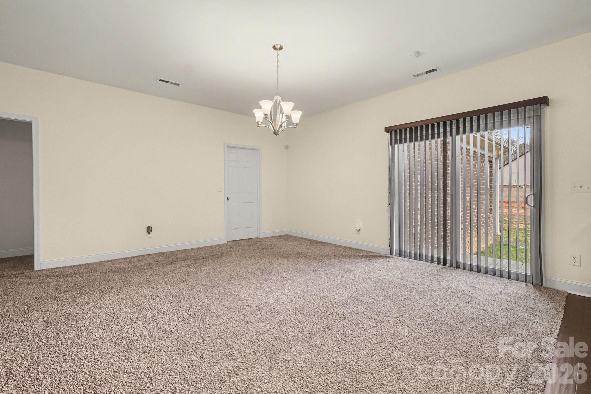 175 Cox Lake Road Stanley, NC 28164 - Photo 29 of 45 a view of a chandelier in big room and chandelier fan