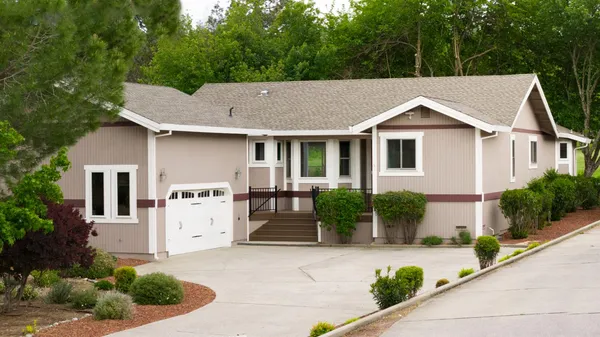 front view of a house with a yard