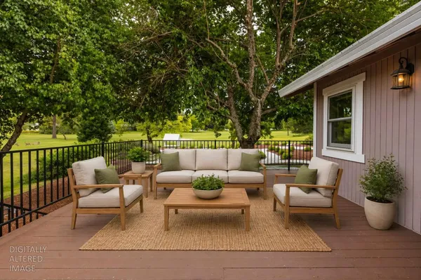 a view of a patio with couches and potted plants