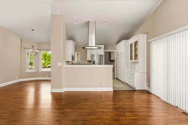 a kitchen with stainless steel appliances granite countertop a refrigerator sink and stove