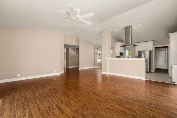 a view of a kitchen with a sink and a microwave