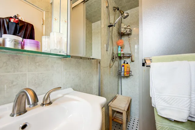 a bathroom with a sink and mirror