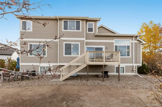 a backyard of a house with yard and deck