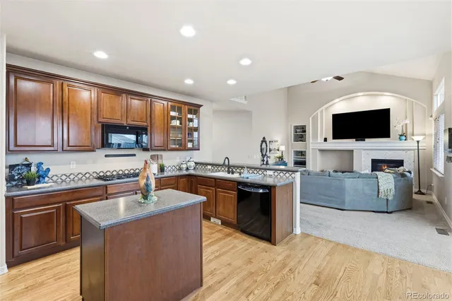 a kitchen with a stove a sink and a microwave