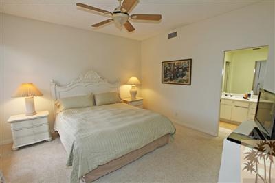 815 Inverness Drive Rancho Mirage, CA 92270 - Photo 17 of 25 a bedroom with a bed and dresser