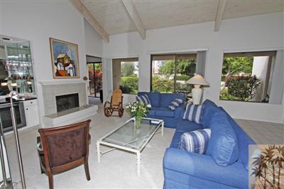 815 Inverness Drive Rancho Mirage, CA 92270 - Photo 4 of 25 a living room with furniture fireplace and a large window