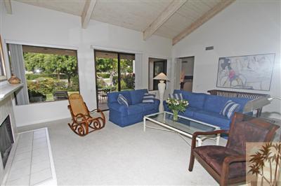 815 Inverness Drive Rancho Mirage, CA 92270 - Photo 5 of 25 a living room with furniture and a large window