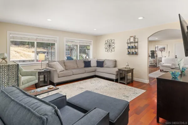 a living room with furniture and a large window