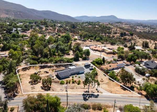 an aerial view of a house with a swimming pool