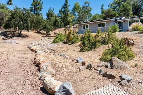 a view of a backyard of the house