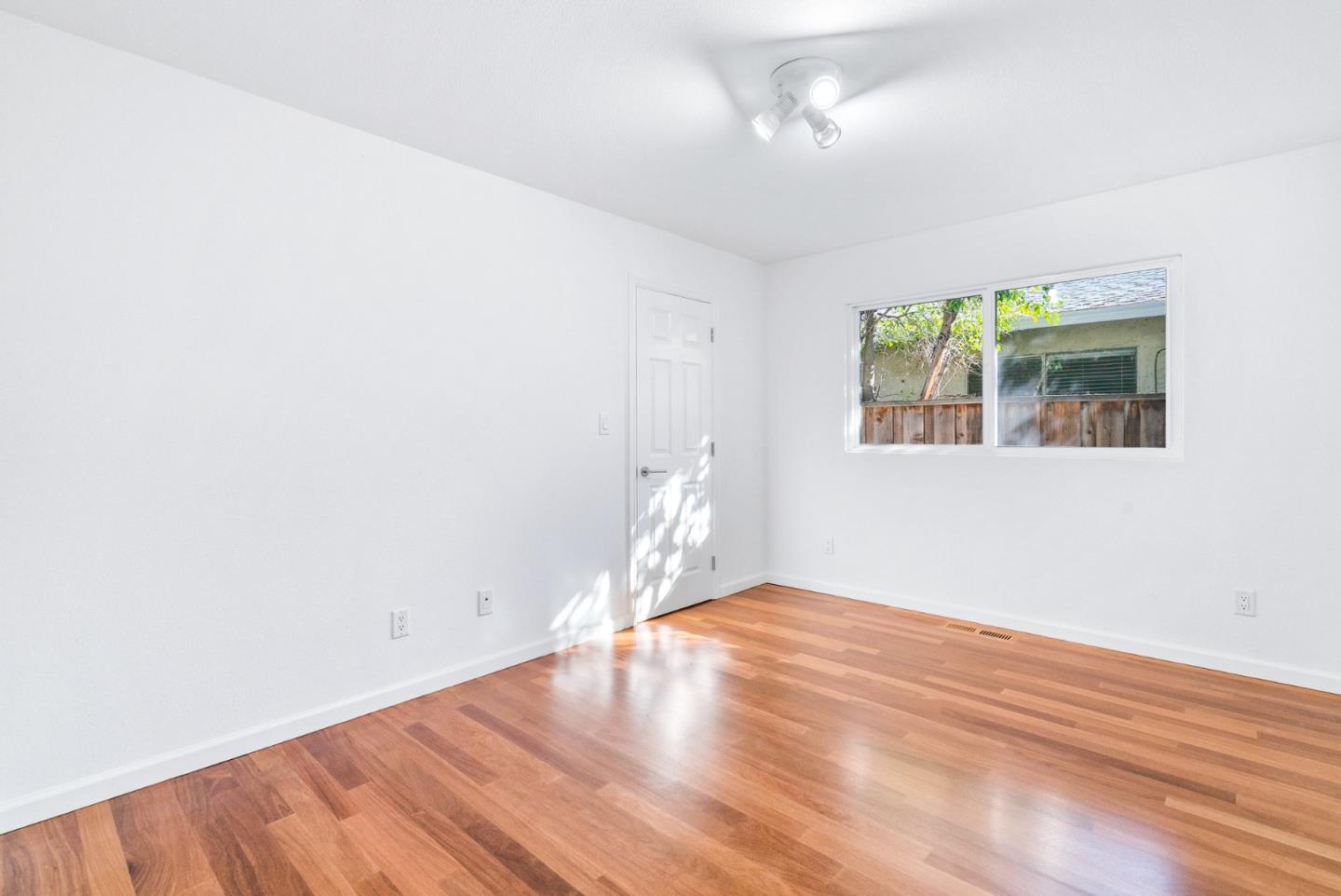 2167 Violet Way Campbell, CA 95008 - Photo 16 of 42 a view of empty room with wooden floor and fan