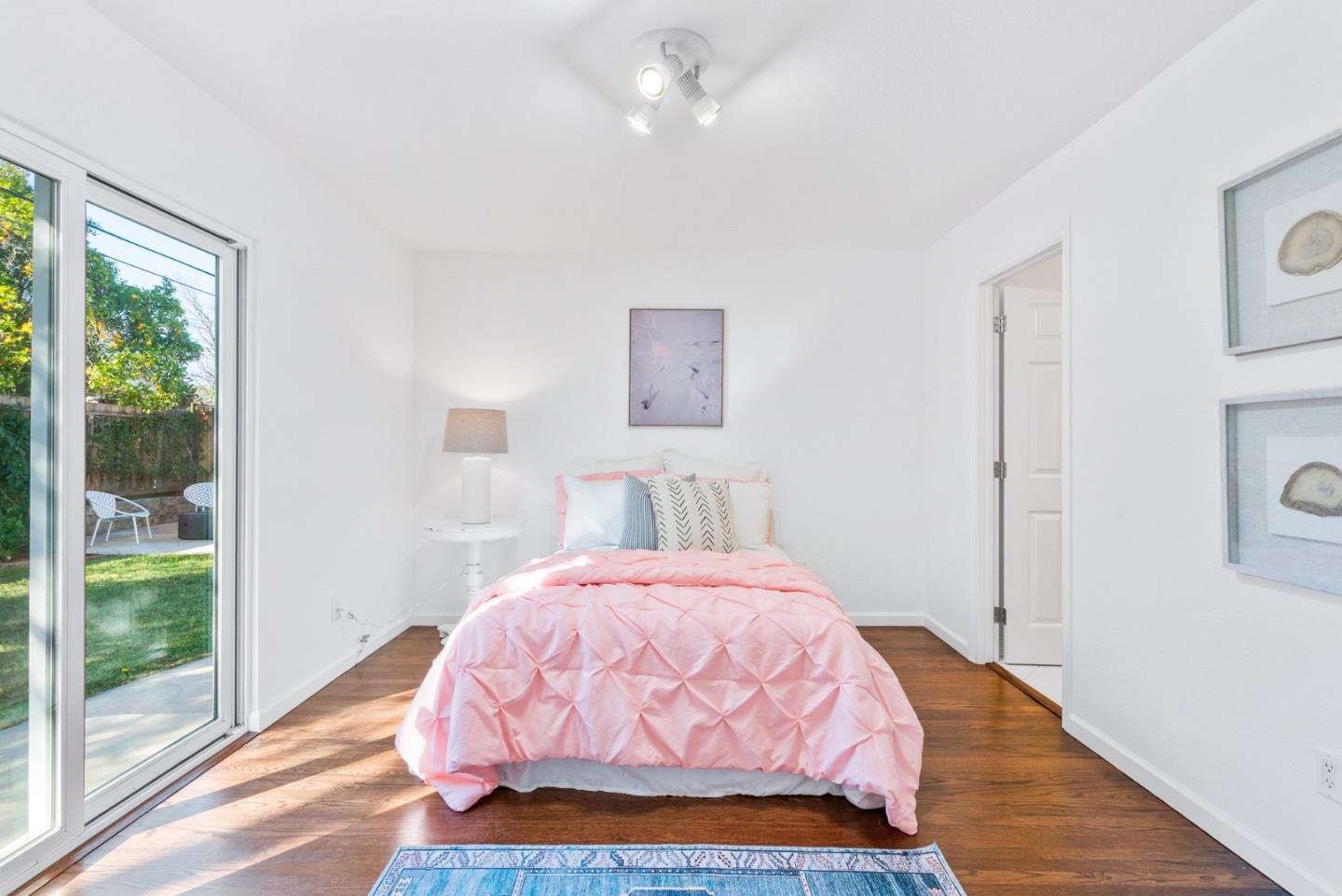 2167 Violet Way Campbell, CA 95008 - Photo 21 of 42 a bedroom with a bed and wooden floor