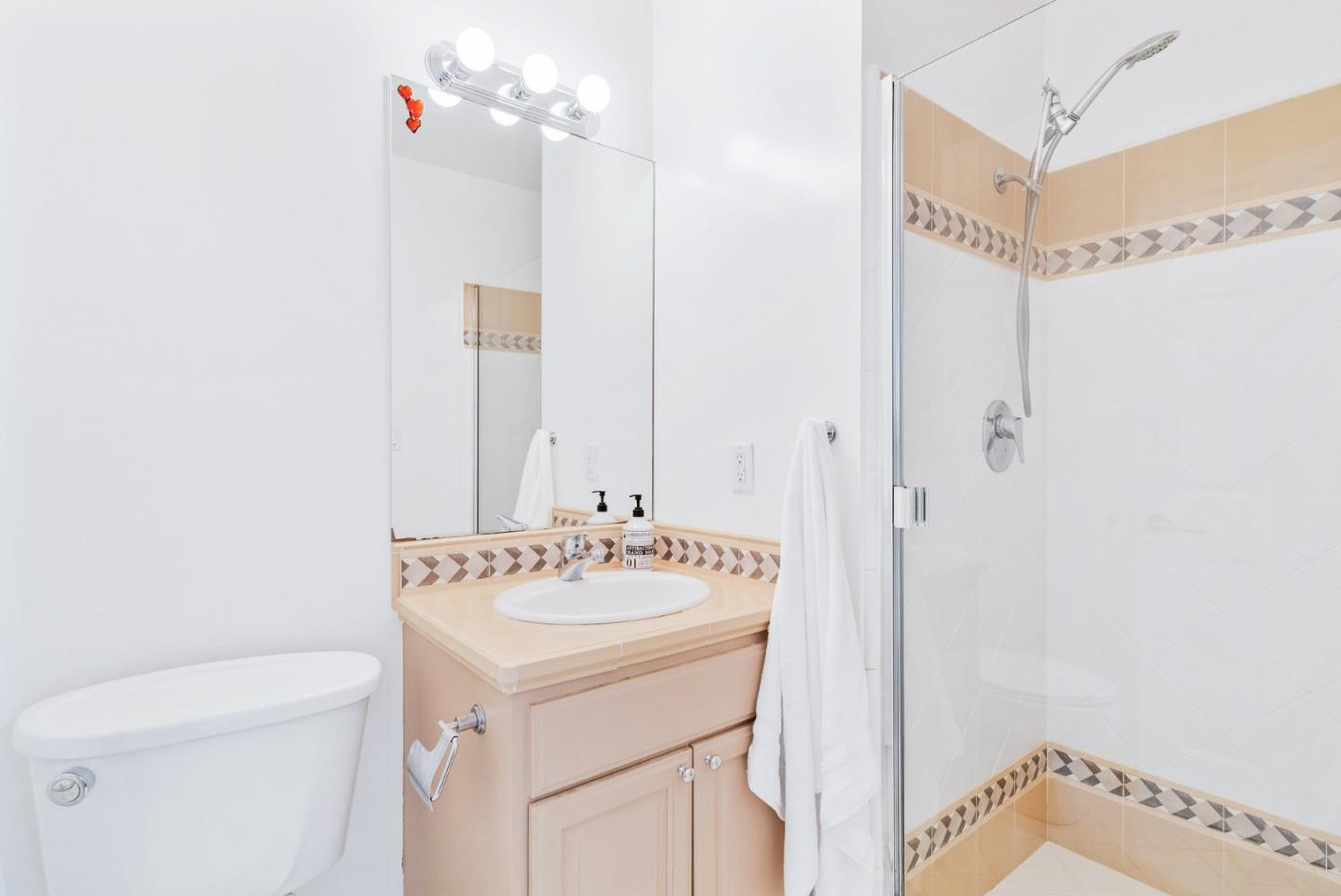 2167 Violet Way Campbell, CA 95008 - Photo 22 of 42 a bathroom with a sink a toilet and a mirror