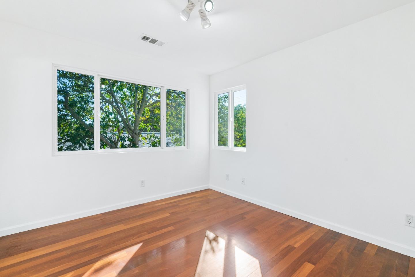 2167 Violet Way Campbell, CA 95008 - Photo 29 of 42 an empty room with wooden floor and windows