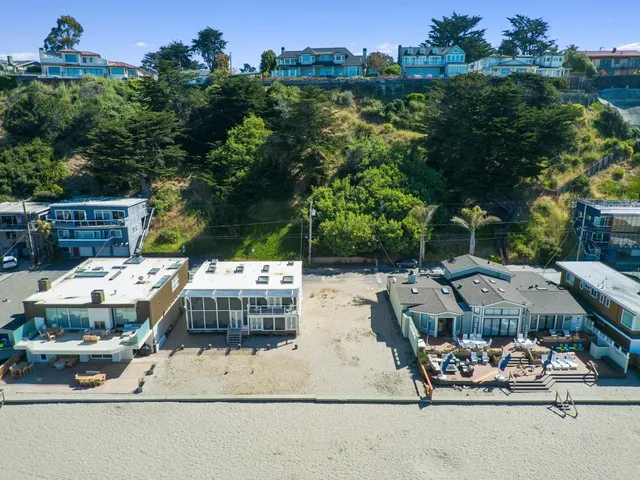 a view of city from balcony with seating space