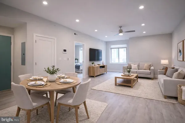 a view of a dining room with furniture and wooden floor