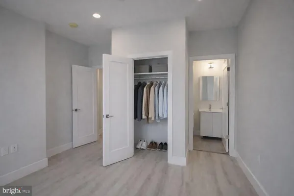 a view of hallway with walk in closet