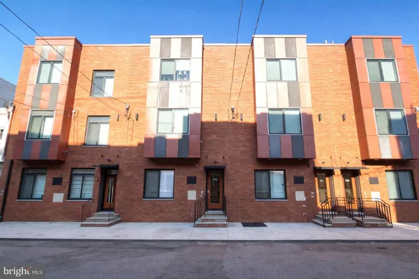 a front view of a multi story residential apartment building
