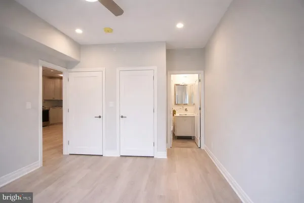 a view of a hallway with a room