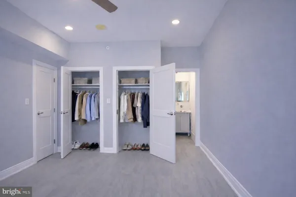 a view of a hallway with some furniture