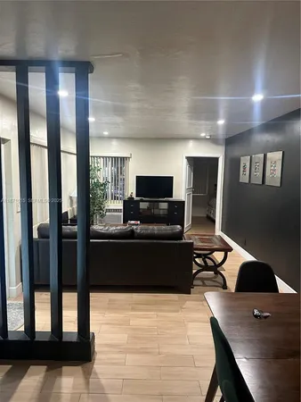 a bed room with a bed window and a chair