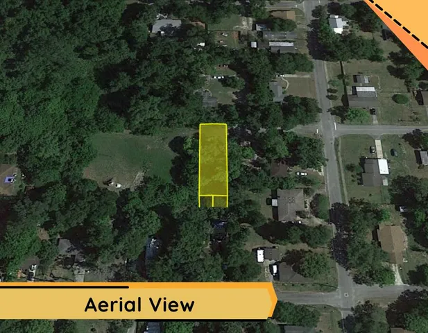 an aerial view of a house with garden space and street view