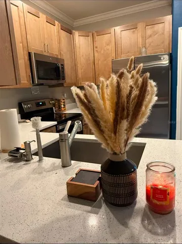 a living room with furniture a flat screen tv and a window