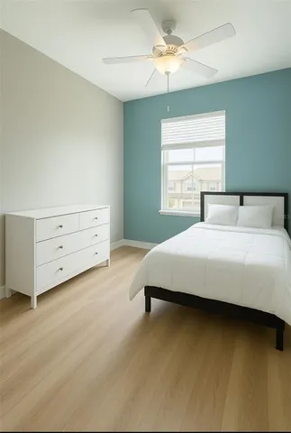 a bedroom with a bed and a dresser