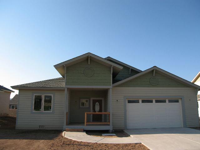 1033 East 19th Street Rifle, CO 81650 - Photo 1 of 1 a front view of a house with garage