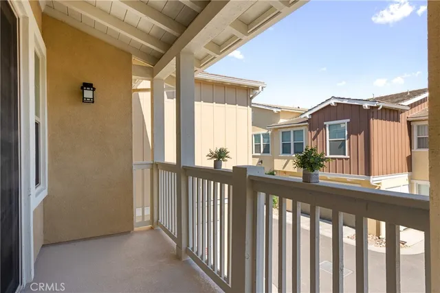 a view of a houses from a balcony