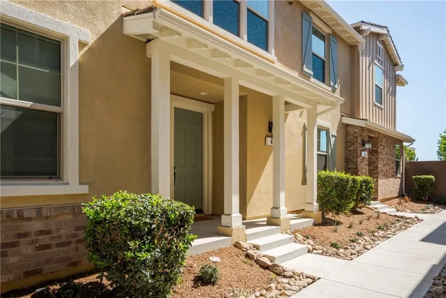 a view of a building with potted plants