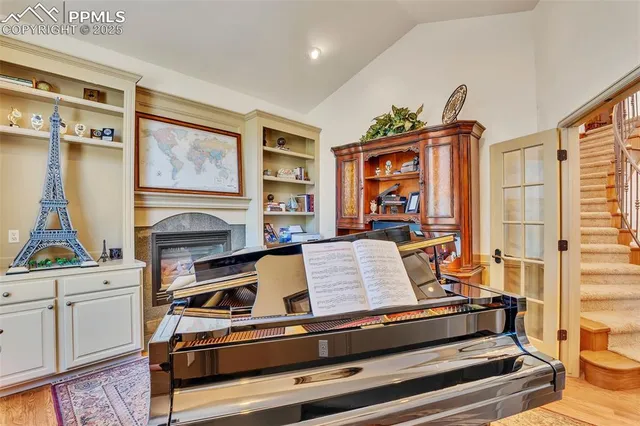 a living room with furniture flat screen tv and a fireplace