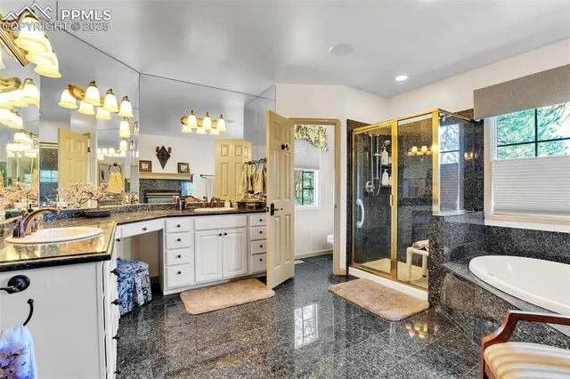 a open kitchen with stainless steel appliances granite countertop a sink a stove a dining table and chairs