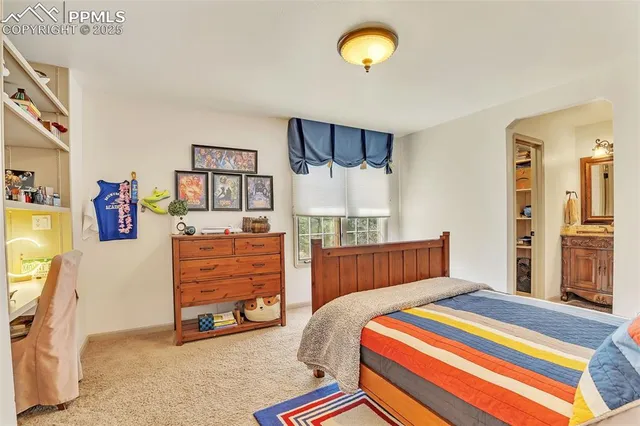 a bedroom with a bed and a cabinets