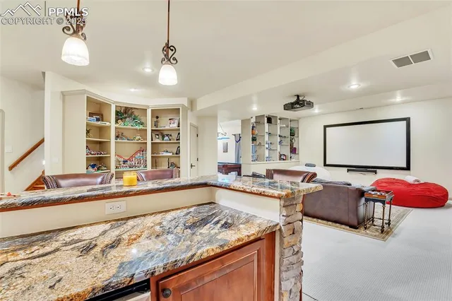 a living room with furniture and large window