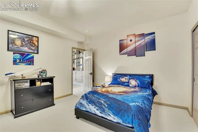 a bedroom with a bed and a cabinets