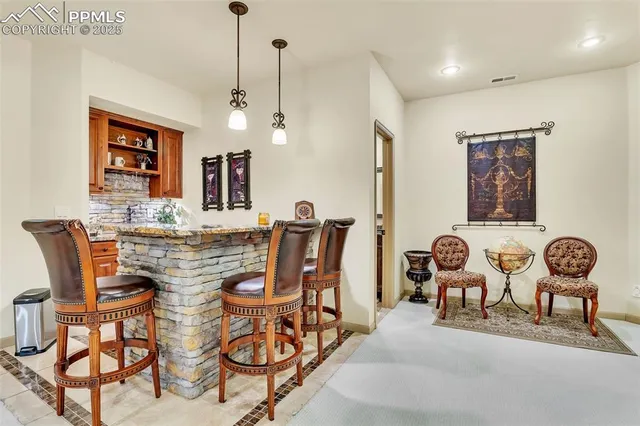 a dining room with furniture and window