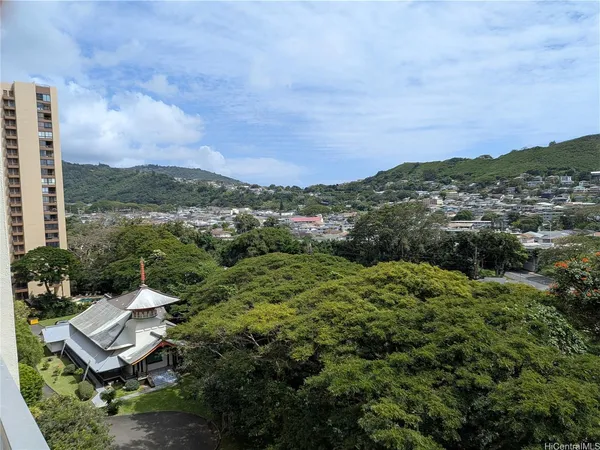 a view of a terrace with a garden and mountain view