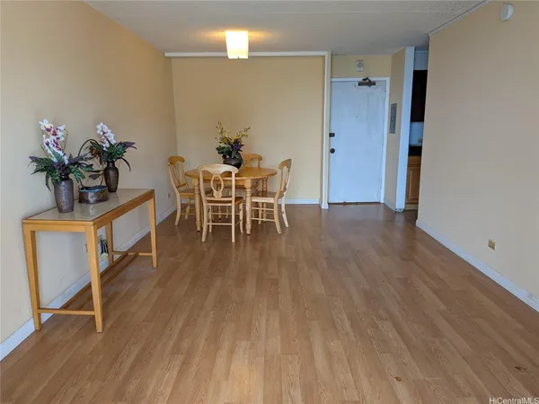 a kitchen with refrigerator and cabinets