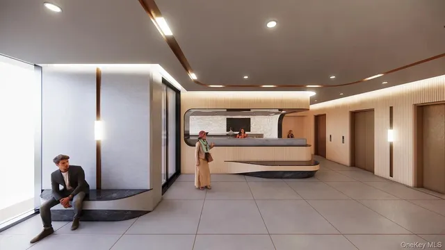 a lobby with a couch and a potted plant