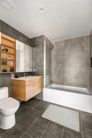 a bathroom with a bathtub sink and toilet