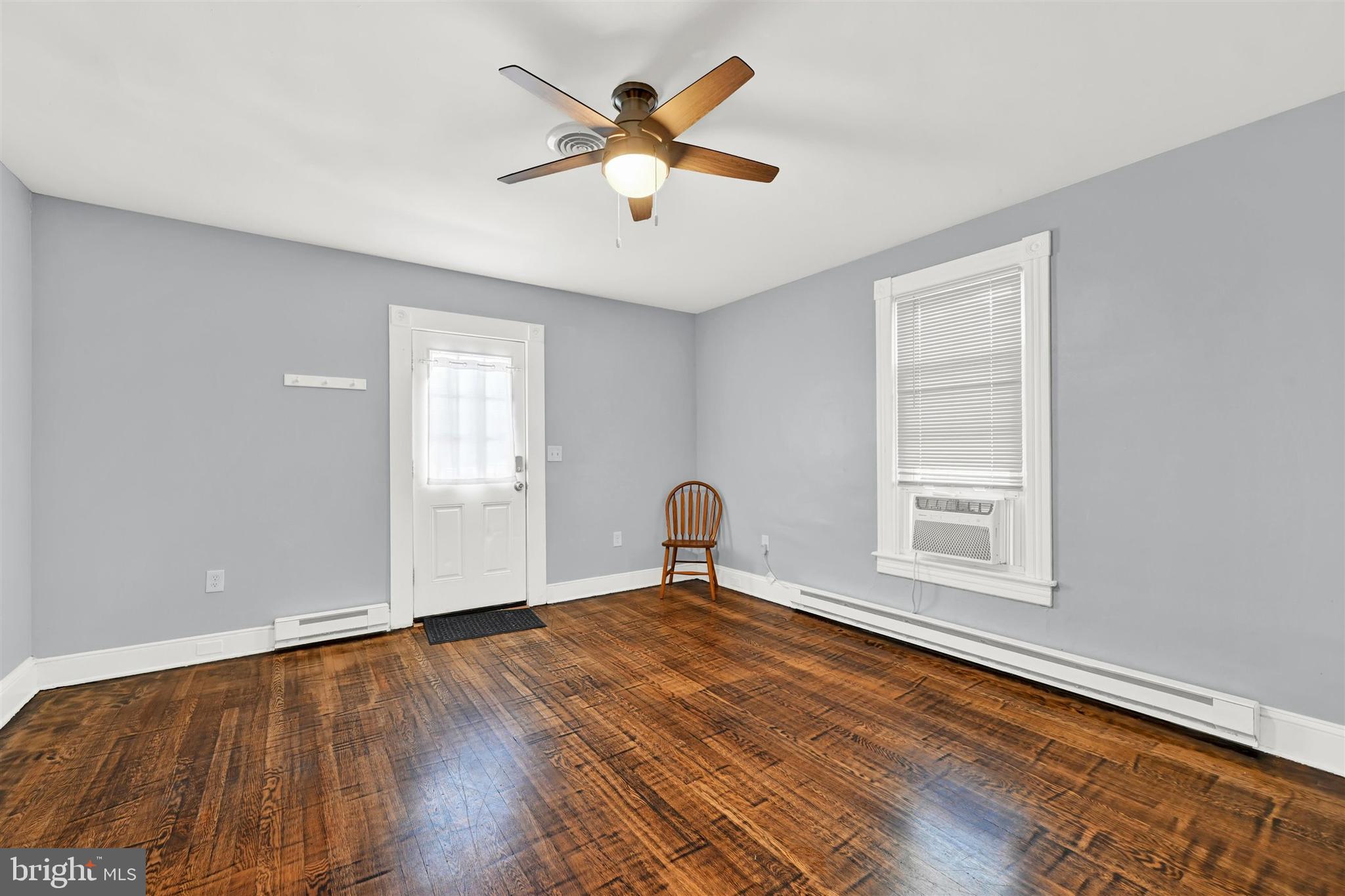 125 West Main Street Westminster, MD 21157 - Photo 14 of 31 a view of empty room with wooden floor and fan