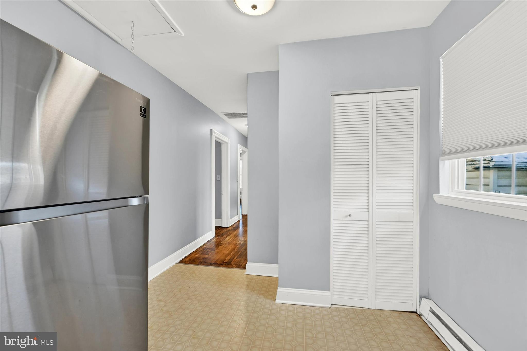 125 West Main Street Westminster, MD 21157 - Photo 16 of 31 a view of a livingroom with wooden floor and staircase