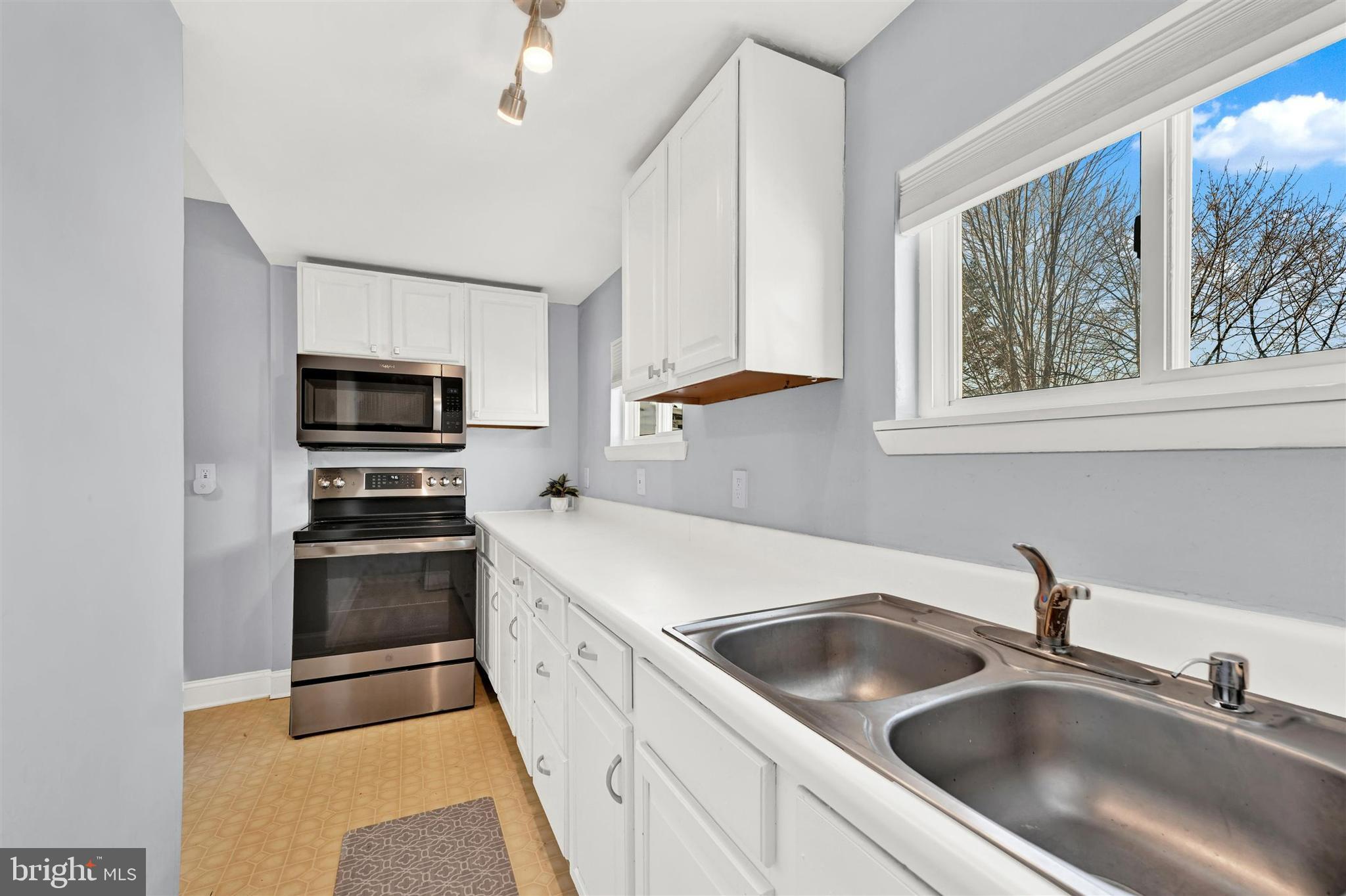 125 West Main Street Westminster, MD 21157 - Photo 20 of 31 a kitchen with stainless steel appliances granite countertop a sink stove and refrigerator
