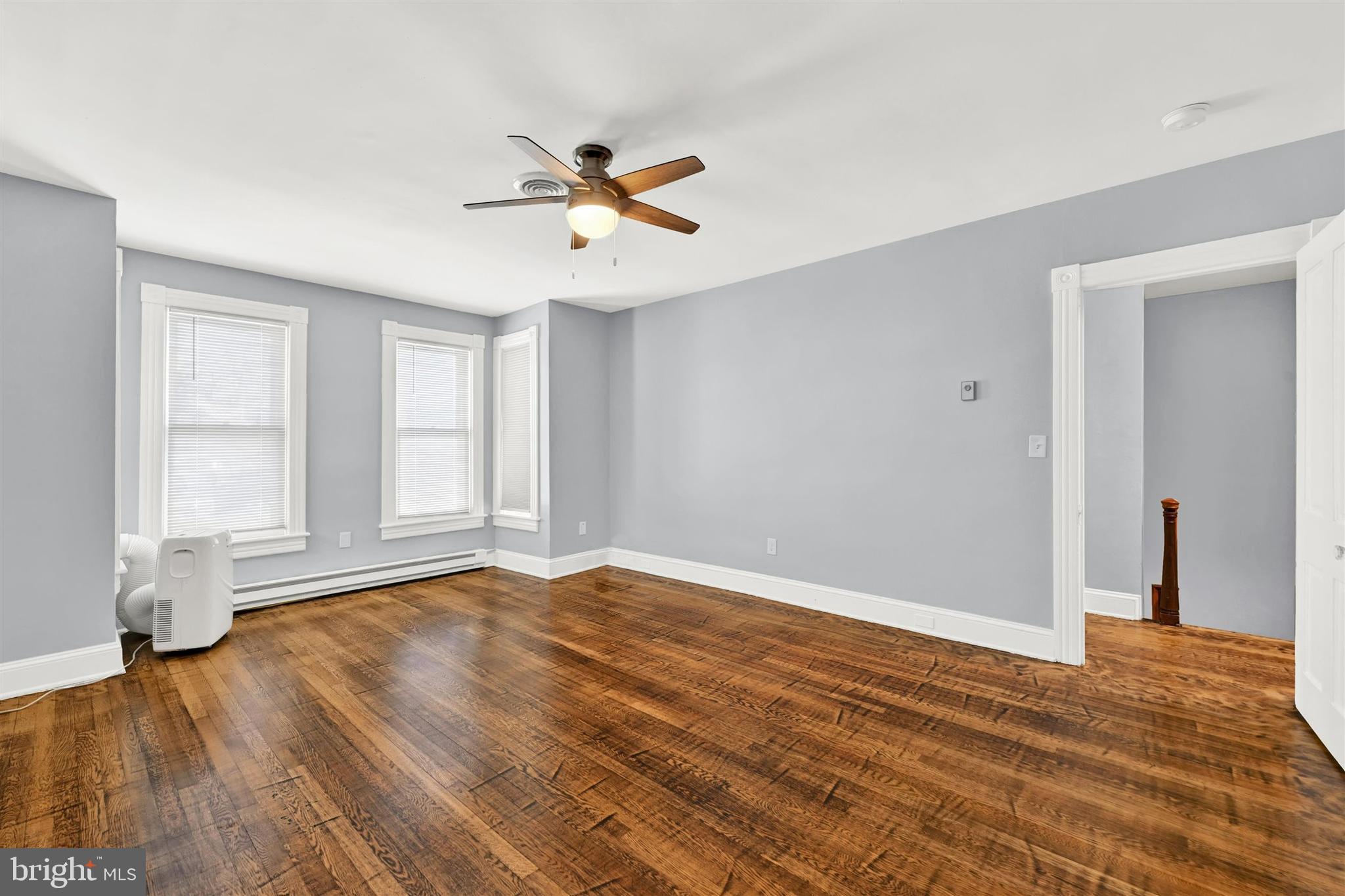 125 West Main Street Westminster, MD 21157 - Photo 25 of 31 a view of empty room with wooden floor and fan