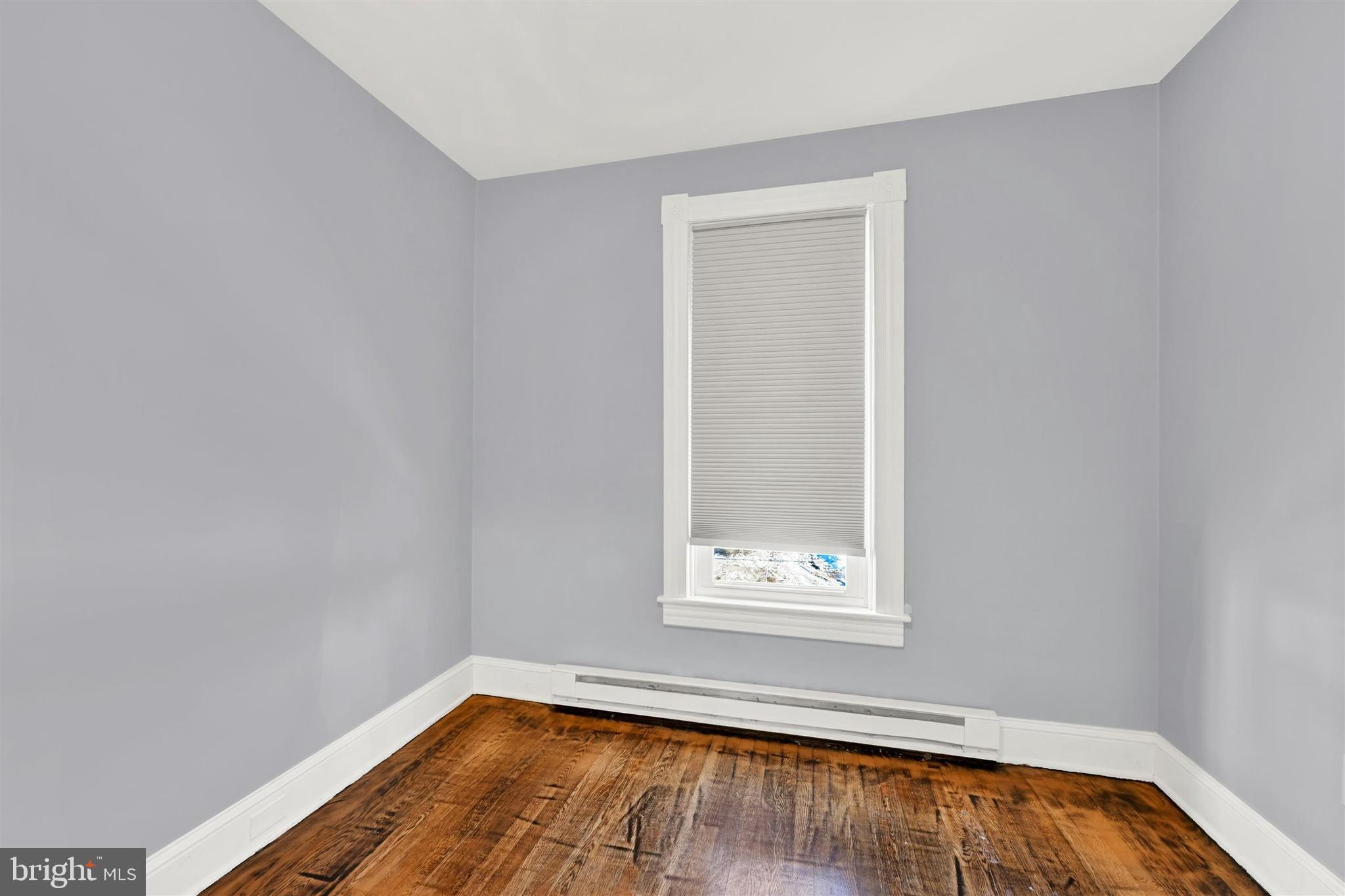 125 West Main Street Westminster, MD 21157 - Photo 28 of 31 a view of a small space with wooden floor and a window