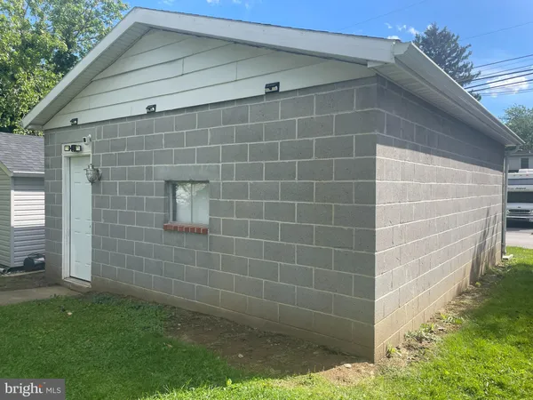 a bathroom with a shower and a sink