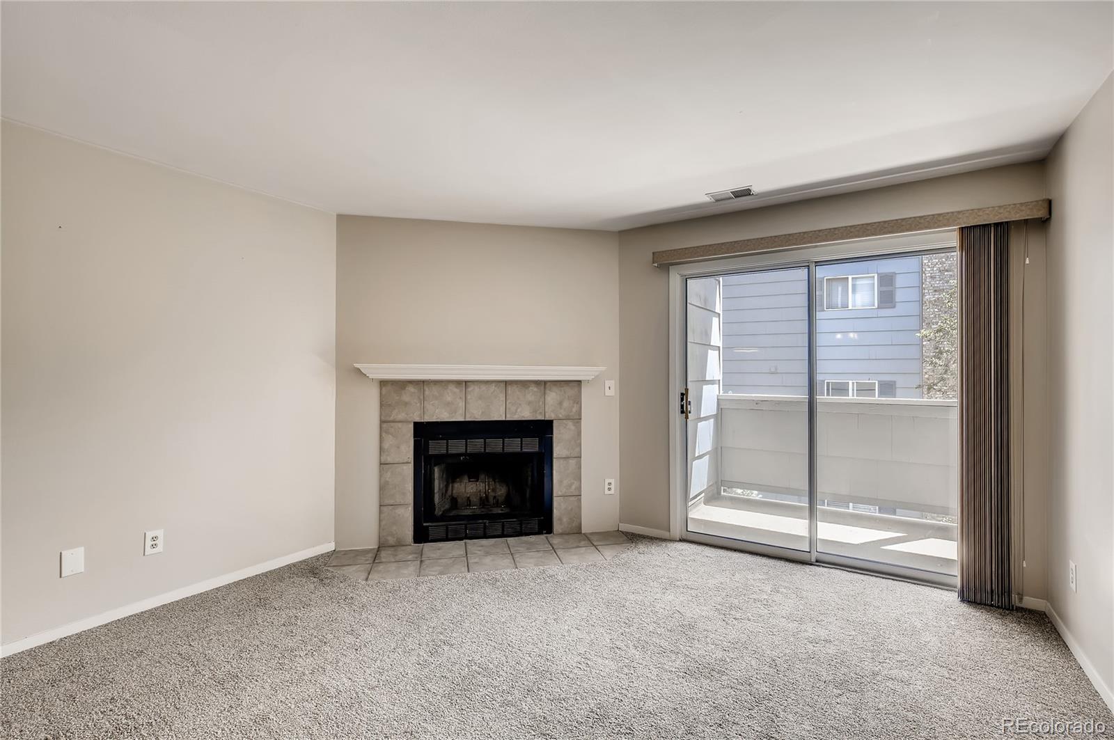 4682 White Rock Circle, Unit 9 Boulder, CO 80301 - Photo 2 of 12 an empty room with fireplace