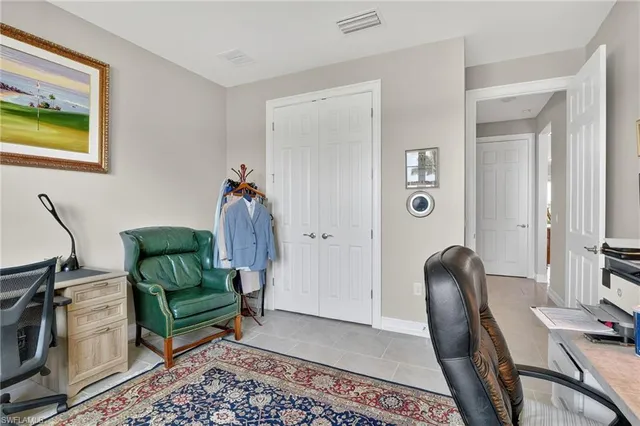 a living room with furniture rug and wooden floor