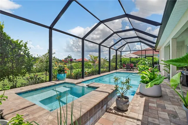 a view of a patio with a table and chairs